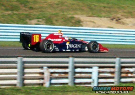 Open-wheel race car with number 16 on the rear wing, sponsored by Pioneer and Argent