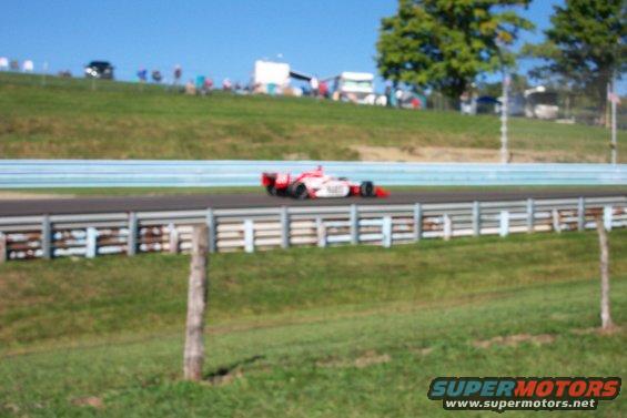 Open-wheel race car on track