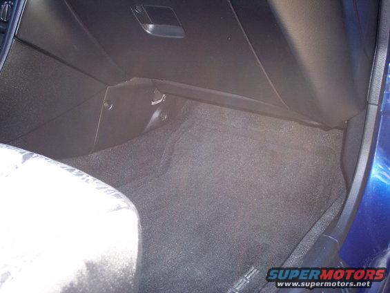 Interior floor and dashboard of a blue car
