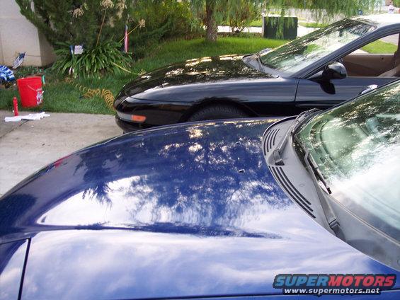 Black car hood and windshield, side view