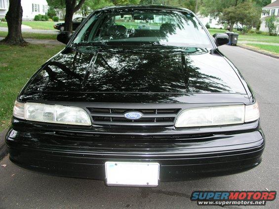 1997 Ford Crown Victoria front view, black paint, license plate area blank