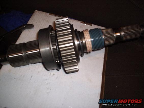 Transfer case input shaft with gears and blue/pink bands
