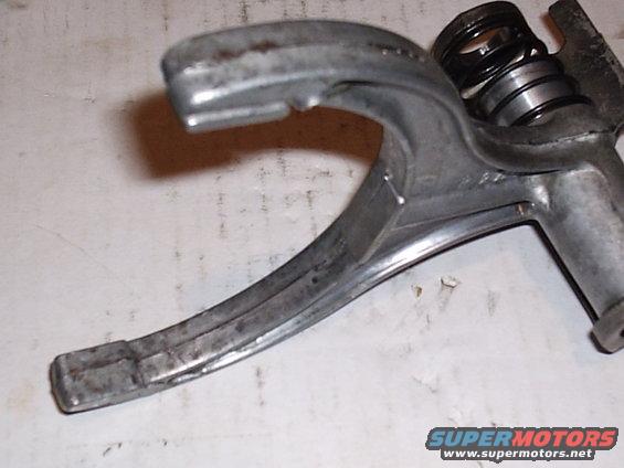 Close-up of a metal lever mechanism with a visible spring
