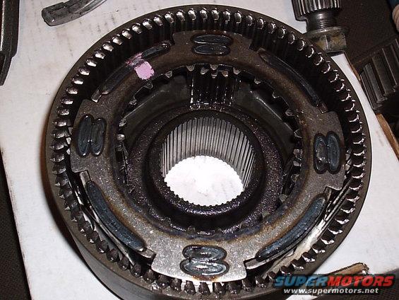 Close-up of a transfer case gear assembly with splines visible in the center
