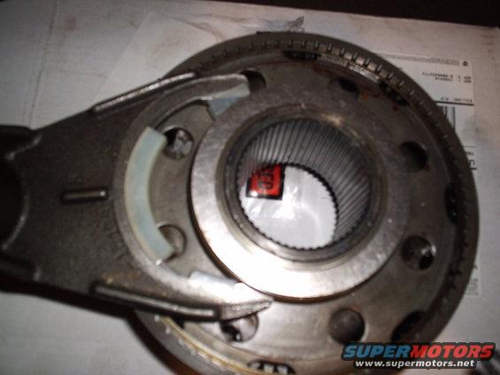 Transfer case part with splined interior and metal housing