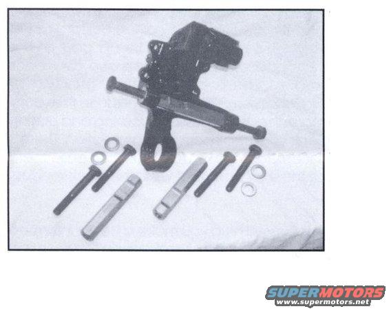 Black suspension part with bolts and washers on a white background