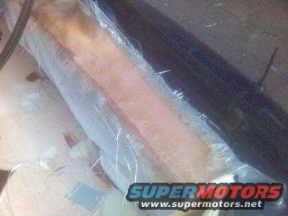 Fiberglass repair in progress, Supermotors.net logo visible