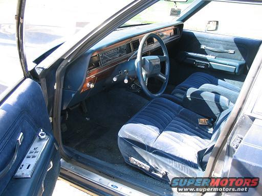 1985 Ford Crown Victoria LTD interior with blue velour seats and wood-grain trim