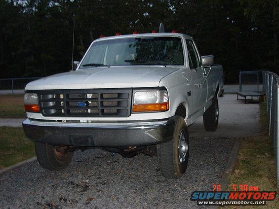 White Ford F-Series truck, front view. Looks like a 1995 model