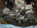 1986 Ford Mustang - Close-up view of engine components including the alternator and AC compressor.