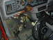 1986 Ford Mustang - The dashboard of a car is disassembled, revealing a complex network of wires and components.