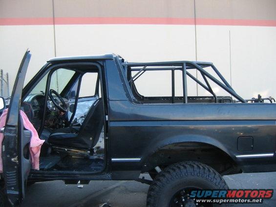 1992 Ford Bronco side view with rollcage installed, interior visible