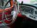 1966 Ford F-250 - The interior of a 1966 Ford F-250 shows its distinctive dashboard, steering wheel, and column shifter.