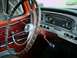 1966 Ford F-250 - The dashboard and steering wheel of an old truck are visible, with a "SUPERMOTORS" watermark at the bottom right.