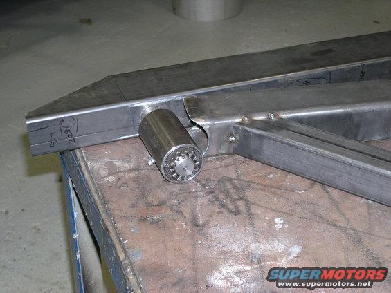 Metal tube with a cylindrical fitting welded on, some markings on the tube