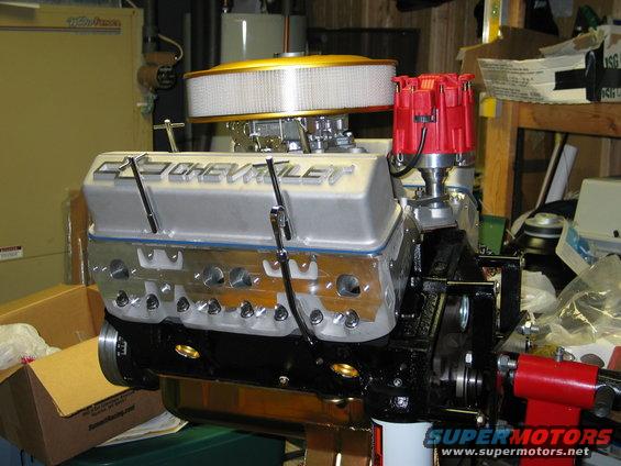 Chevrolet V8 engine with aluminum valve covers, carburetor, and distributor