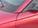 1996 Ford Mustang - This photo shows a close-up of a red car's side mirror and door panel, with a timestamp from 2005.