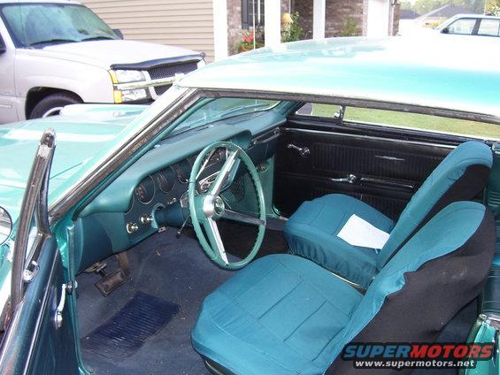 1967 Pontiac Lemans interior with teal seats and dashboard