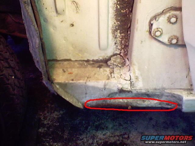 It's hard to see from this pic. But this area is rusted. Part of the splash guard was missing on this side of the car. The water found its way inside.