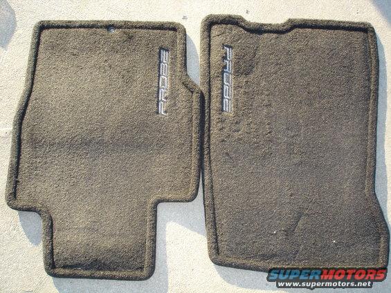 Two dark gray car floor mats with 'PROBE' embroidered on them