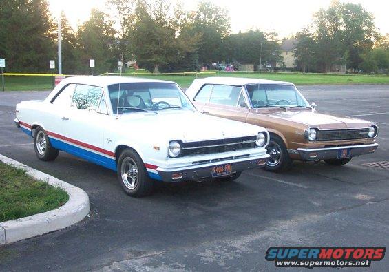 1967 Rambler American 2-door hardtop, white with red and blue stripes, parked next to a tan 1967 Rambler American