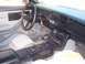 1988 Chevrolet Camaro - The interior of a 1988 Chevrolet Camaro, its dashboard, steering wheel, and automatic transmission shifter.