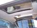 1988 Chevrolet Camaro - Interior view of a car's headliner and sunroof mechanism, with a visible date stamp.
