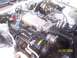 1988 Chevrolet Camaro - Close-up view of the engine compartment of a 1988 Chevrolet Camaro, showing various engine components.