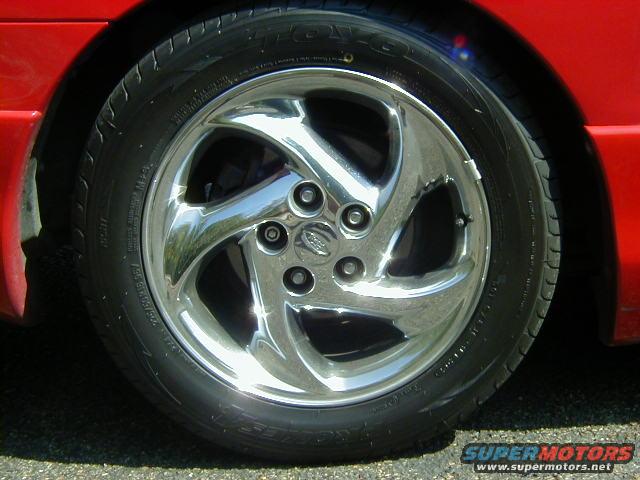Red car wheel with chrome five-spoke rim