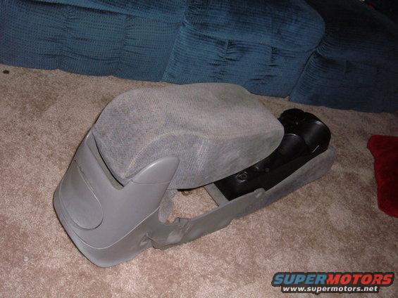 Gray car seat console with black interior components