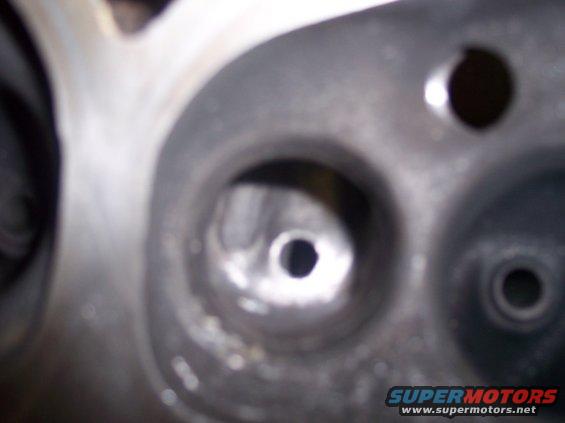 Close-up of an engine cylinder head with two visible ports