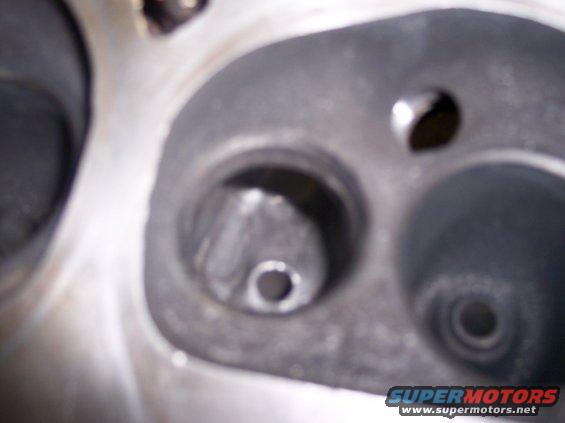 Engine cylinder head with valve seats visible