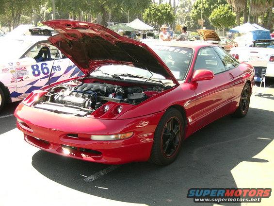 Red 1993 Ford Probe, 3q-front view, hood open showing engine