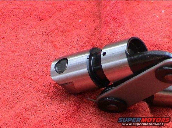 Engine valve lifters on a red cloth