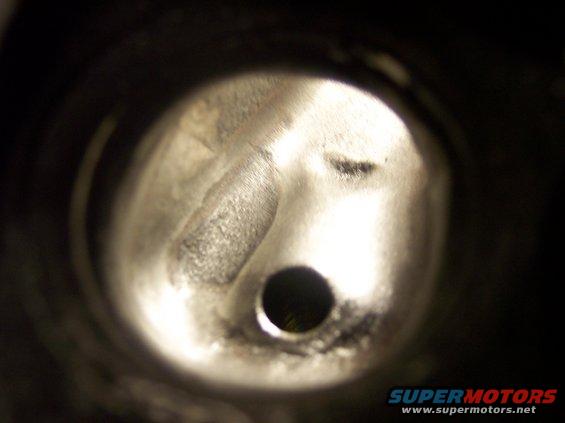 close-up of engine cylinder head with a valve opening