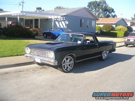 Black 1966 Ford Ranchero, 3/4 front view, with chrome wheels