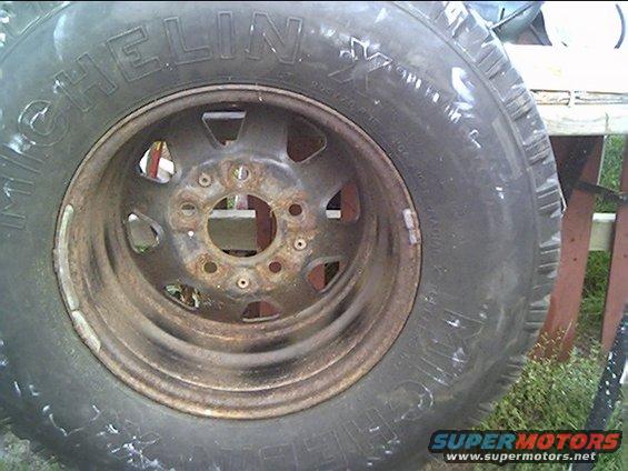 Close-up of a Michelin tire on a rusty rim