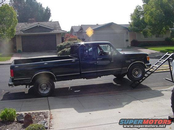 Black Ford F-Series pickup truck on a ramp