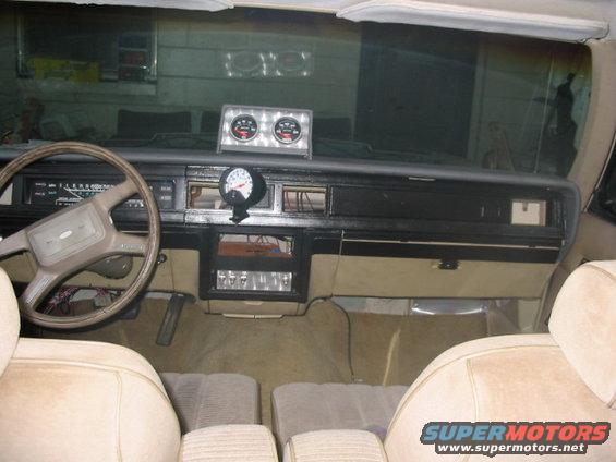 1985 Ford Crown Victoria LTD interior showing dashboard, steering wheel, and aftermarket gauges