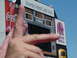 1996 Ford Mustang - A scoreboard displays game information and advertisements, with a hand obscuring part of the view.