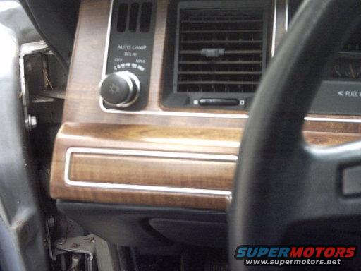 1991 Ford Crown Victoria LTD interior dashboard with wood trim, air vents, and auto lamp control