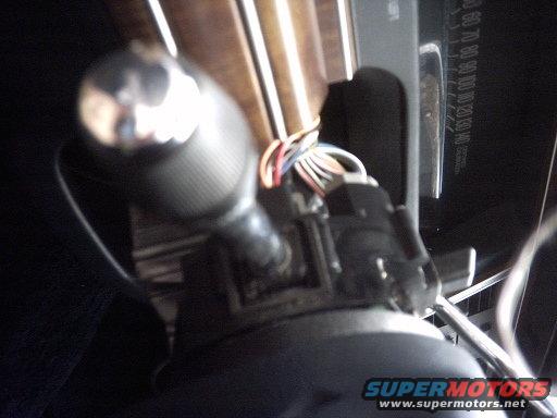 Interior view of a 1991 Ford Crown Victoria LTD showing a chrome gear shifter and dashboard gauges