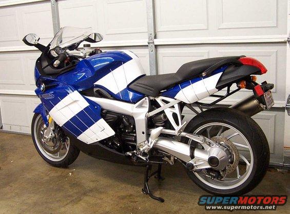 Blue and white BMW R1200CA ABS motorcycle parked in garage