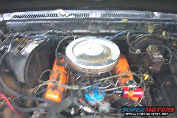 Engine bay with orange valve covers and a chrome air cleaner