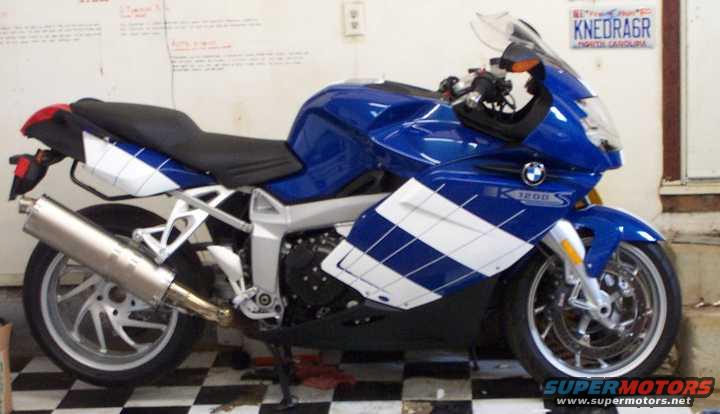 Blue and white BMW K1200S motorcycle parked indoors