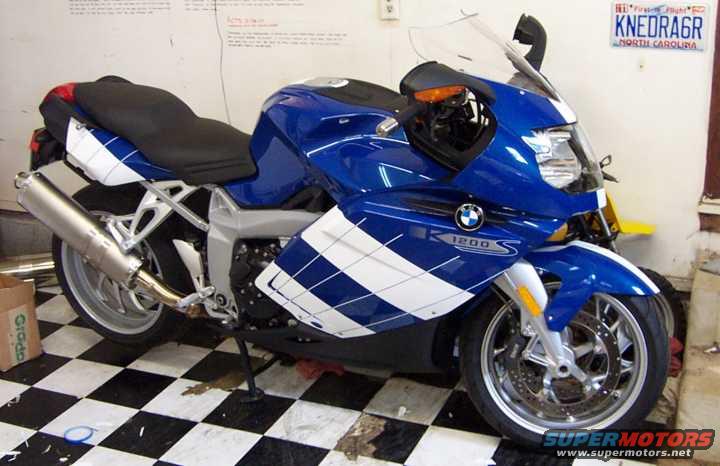 Blue and white 2005 BMW R1200CA ABS motorcycle with a silver exhaust and a license plate from North Carolina