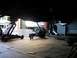 1979 Chevrolet C/K Pickup - Vehicle transmission removed and placed on the floor, supported by a floor jack.