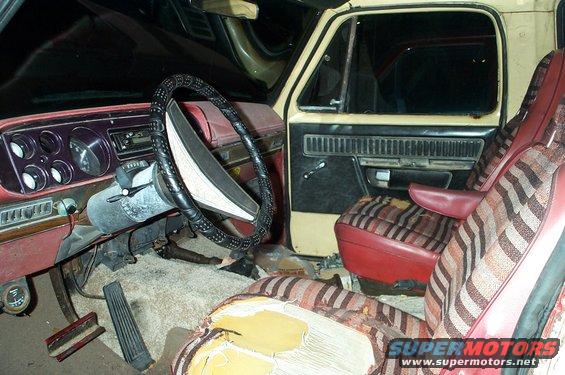 Interior of a 1978 Dodge Power Ram showing worn seats and dashboard