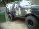 1988 Ford Bronco - This Ford Bronco is painted in a camouflage pattern and equipped with large off-road tires.