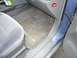 1999 Ford Taurus - The interior of a car shows a blue door and grey seating with a "no smoking" sticker on the dashboard.